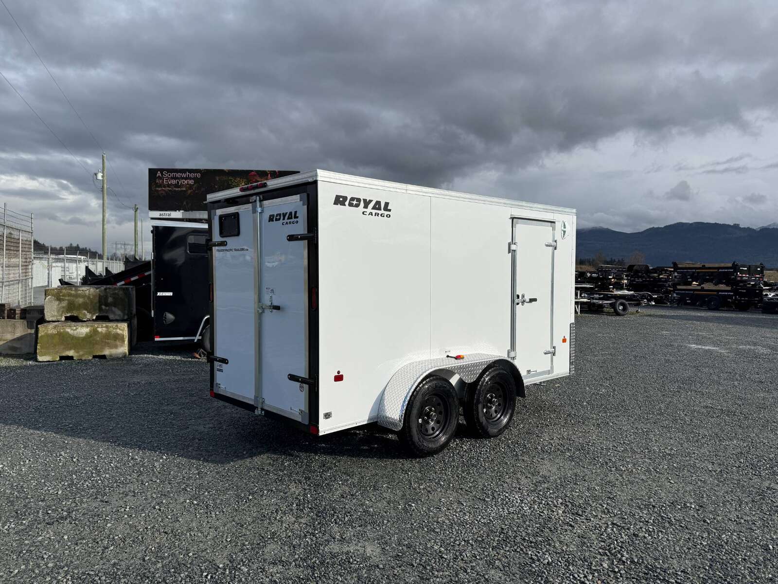 Photo of 2025 Royal Cargo 6x12 Tandem Axle Cargo / Enclosed Trailer Flat Front White Rear Barn Doors 7700lb GVW