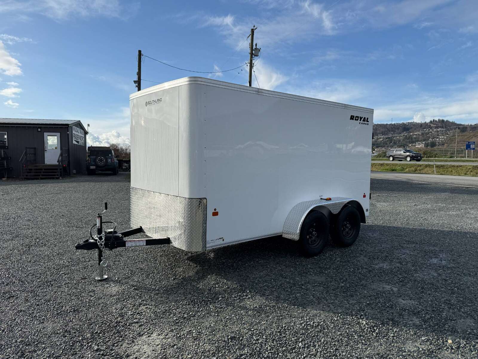 Photo of 2025 Royal Cargo 6x12 Tandem Axle Cargo / Enclosed Trailer Flat Front White Rear Barn Doors 7700lb GVW