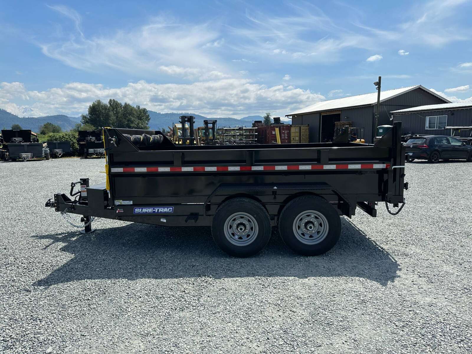 Photo of New SureTrac 7x12 Telescopic Hoist Dump Trailer 14,000lbs GVW w/ Ramps and Tarp