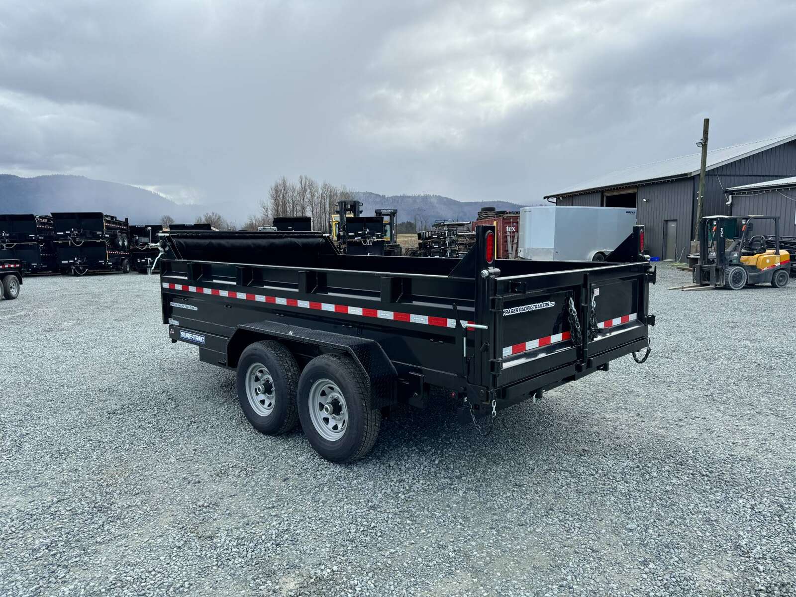 Photo of New SureTrac 7x14 Telescopic Hoist Dump Trailer 14,000lbs GVW w/ Ramps and Tarp