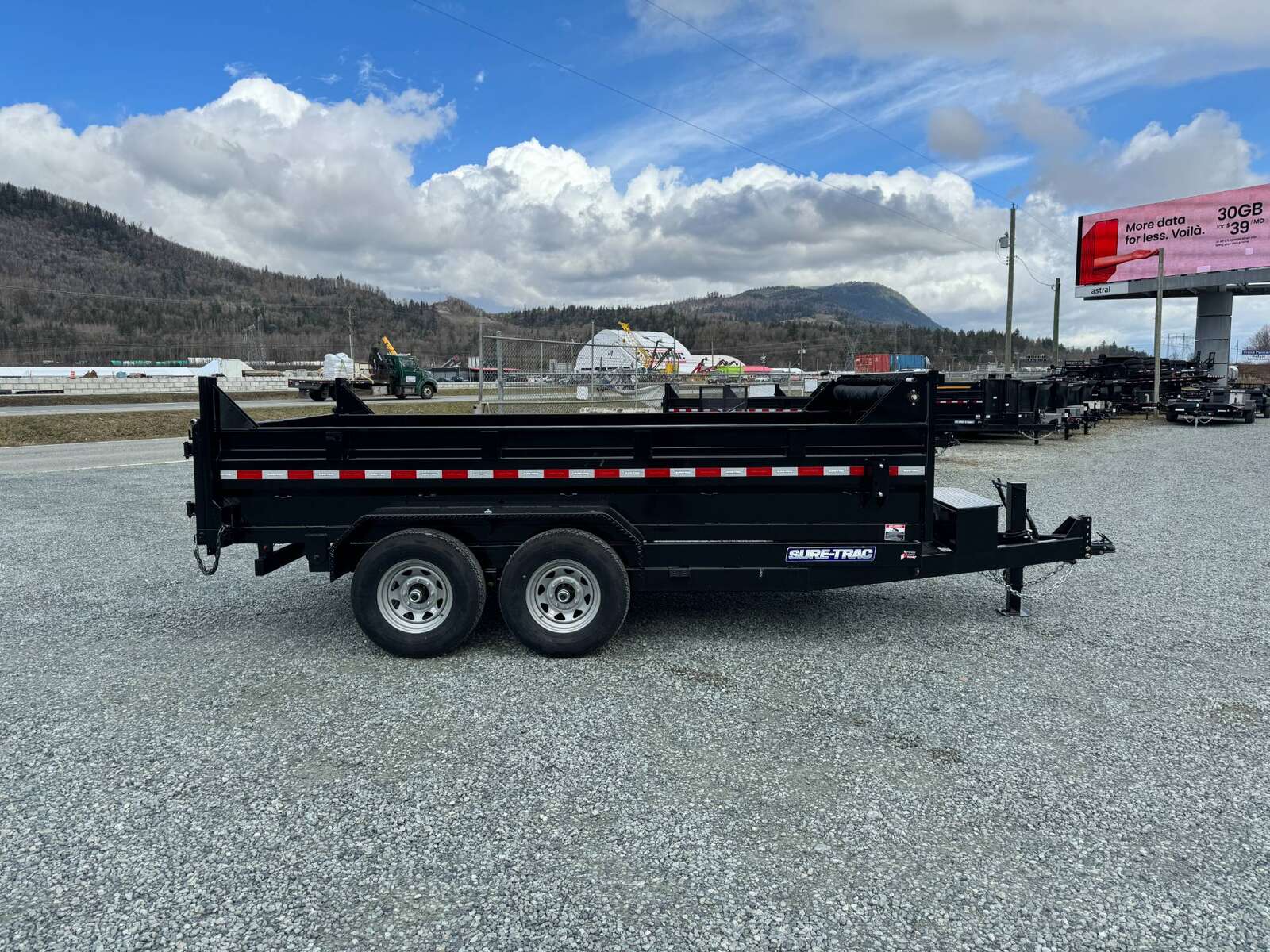 Photo of New SureTrac 7x14 Telescopic Hoist Dump Trailer 14,000lbs GVW w/ Ramps and Tarp