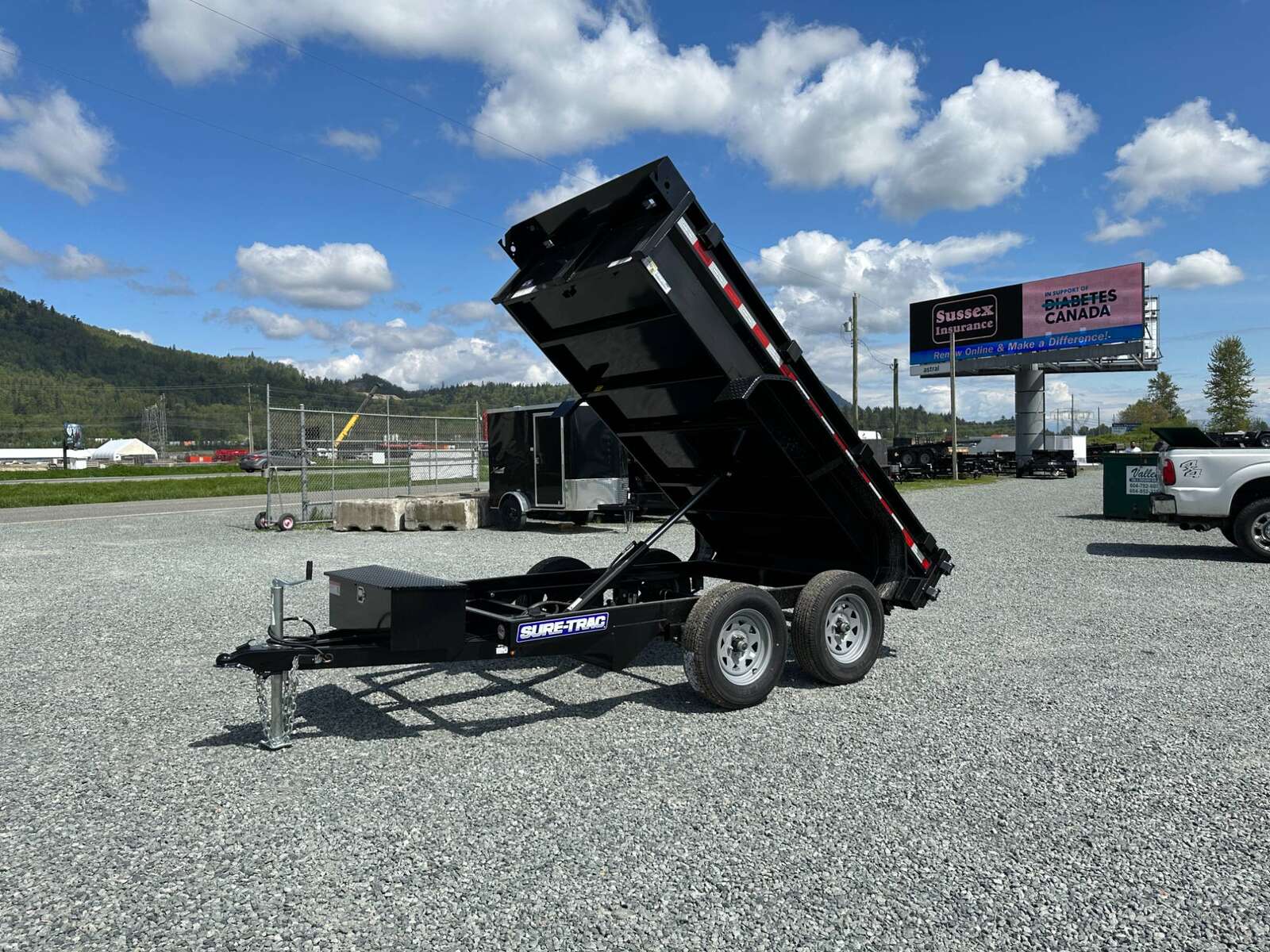 Photo of 2024 Suretrac 5x10 Dump Trailer 7000lb GVW Barn Doors