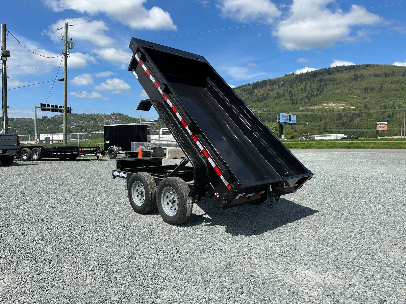 Photo of 2024 Suretrac 5x10 Dump Trailer 7000lb GVW Barn Doors