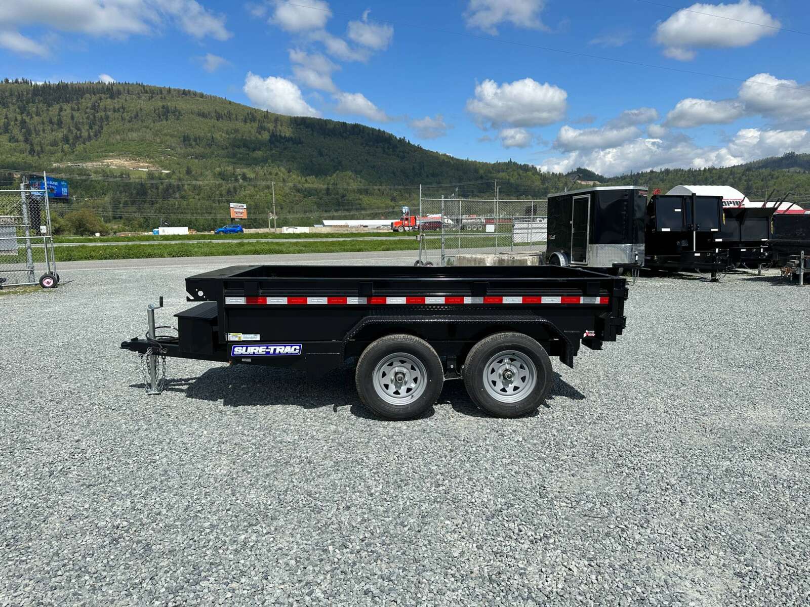 Photo of 2024 Suretrac 5x10 Dump Trailer 7000lb GVW Barn Doors