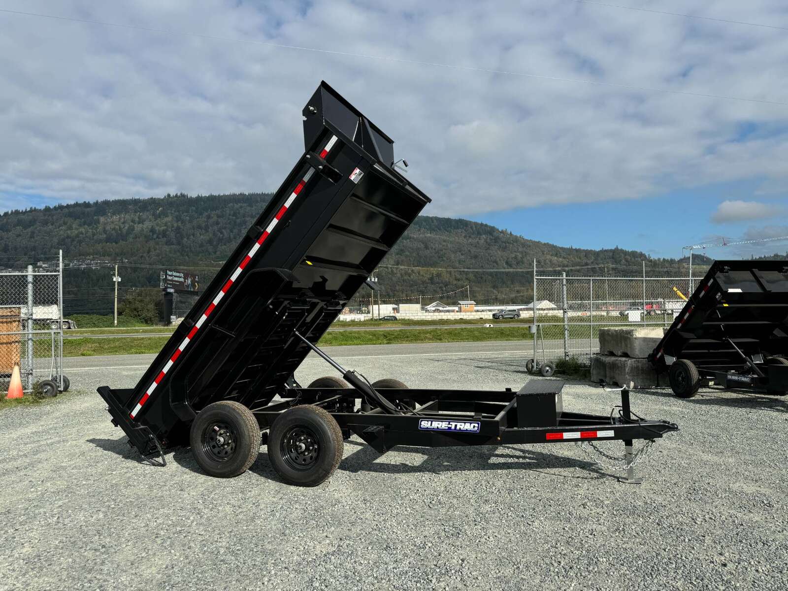 Photo of 2025 SURETRAC 6X12 DUMP TRAILER 9,900LBS GVW W/RAMPS & TARP