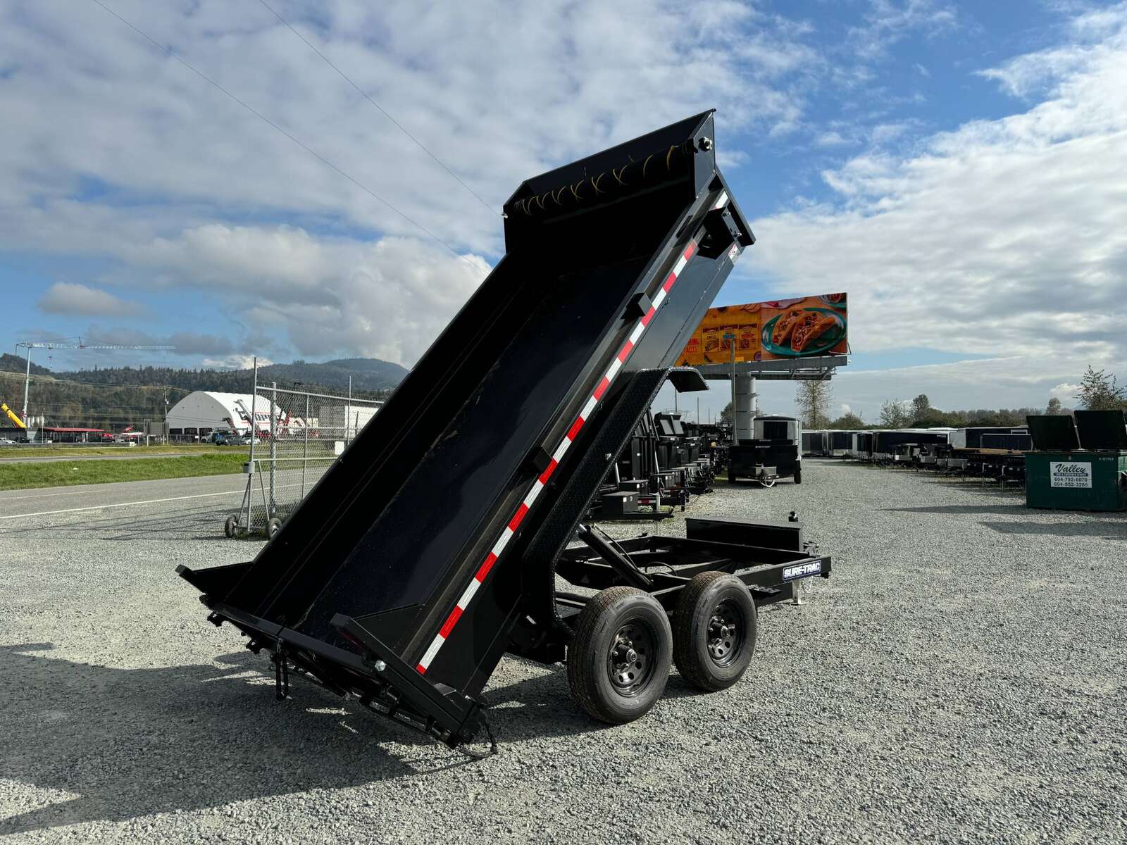 Photo of 2025 SURETRAC 6X12 DUMP TRAILER 9,900LBS GVW W/RAMPS & TARP