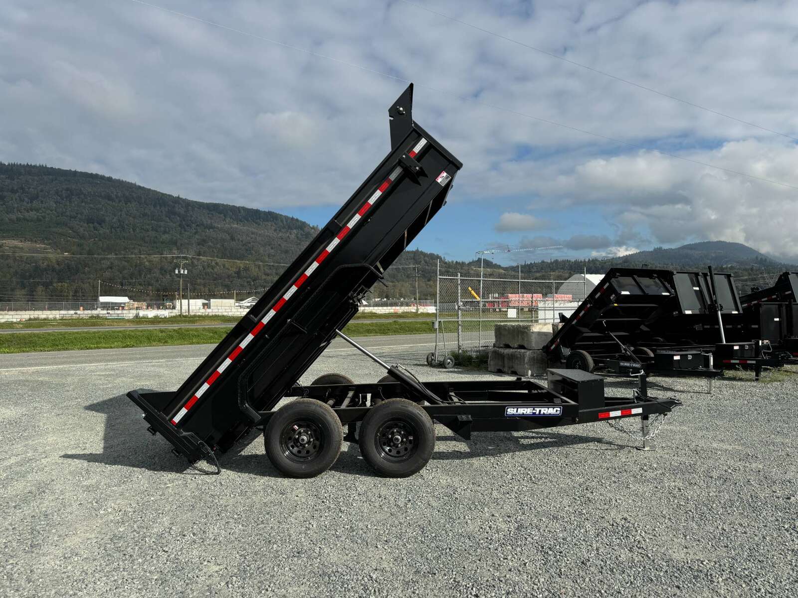 Photo of 2025 SURETRAC 6X12 DUMP TRAILER 9,900LBS GVW W/RAMPS & TARP