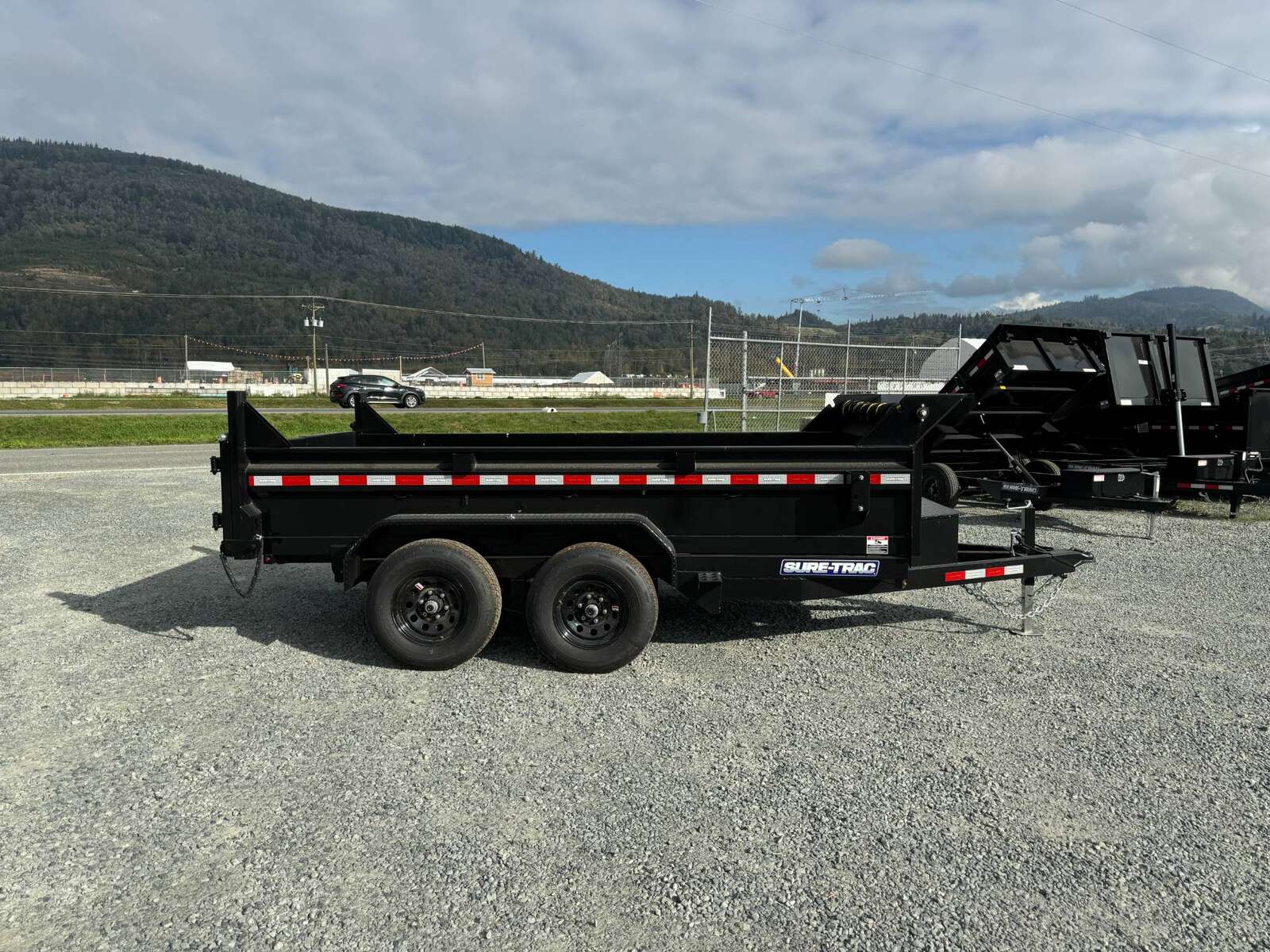 Photo of 2025 SURETRAC 6X12 DUMP TRAILER 9,900LBS GVW W/RAMPS & TARP