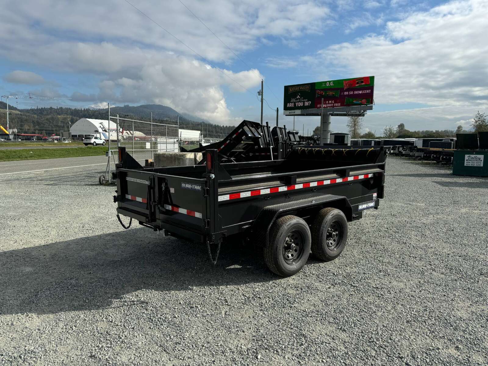 Photo of 2025 SURETRAC 6X12 DUMP TRAILER 9,900LBS GVW W/RAMPS & TARP